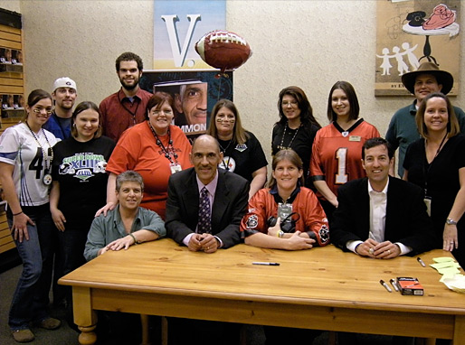 Staff–all decked out in their football-gear posed with Tony at the Barnes & Noble signing in Tampa - © All rights reserved. Photo by Jessica Atteberry Quinn