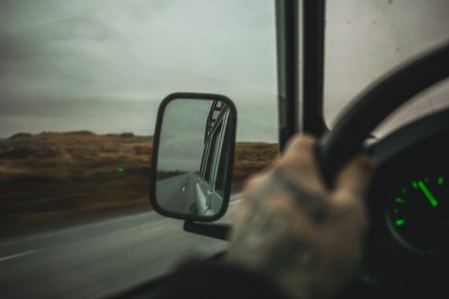 A man's tattooed hand grips a steering wheel. What happens when we allow Jesus to take the wheel? That's what we explore in this post.