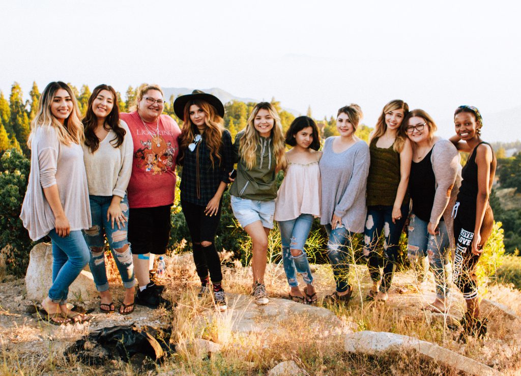 A group of 10 women stand and smile together taking a group picture. They make up an example of a strong small group. A group of 10 women stand and smile together taking a group picture. They make up an example of a strong small group.